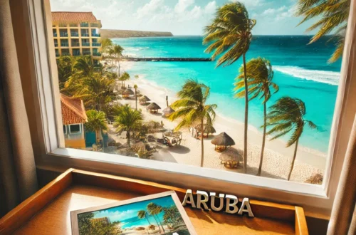 stunning view from a hotel room window overlooking the beautiful beaches of Aruba. The scene captures the turquoise ocean, white sandy beaches.